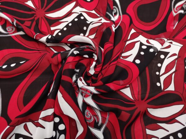 Tessuto Georgette a fantasia motivo astratto rosso - nero