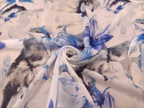 Tessuto Georgette a fantasia motivo floreale bianco - azzurro