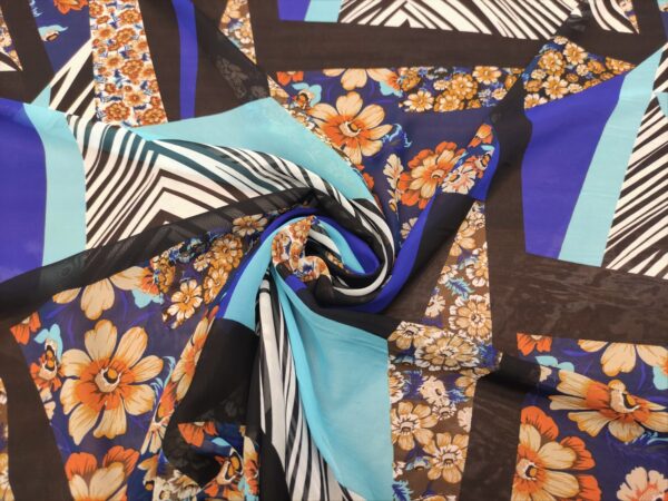 Tessuto Georgette a fantasia motivo floreale blu - arancione