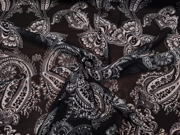 Tessuto Georgette a fantasia motivo floreale cashmere nero - bianco
