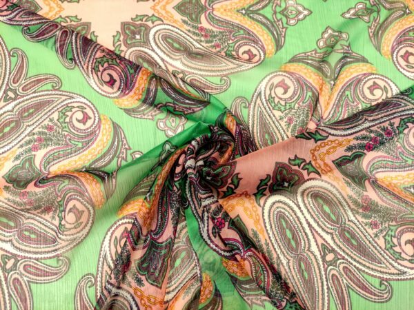 Tessuto Georgette a fantasia motivo floreale cashmere verde - arancione