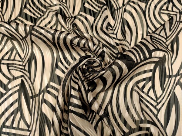 Tessuto Georgette a fantasia motivo geometrico beige - nero 01