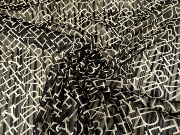 Tessuto Georgette a fantasia motivo geometrico beige - nero 02