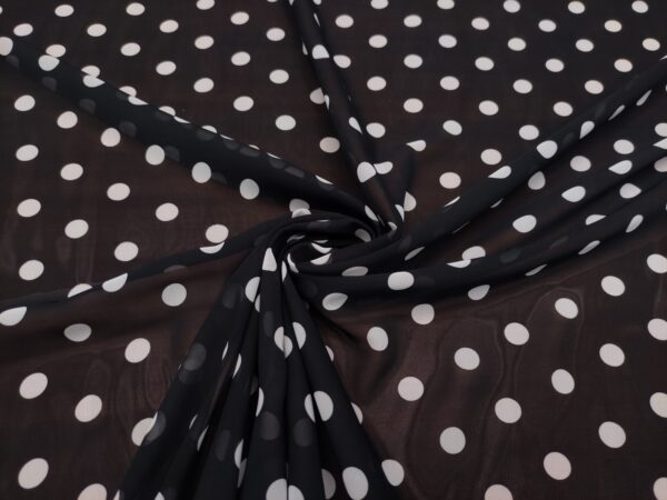 Tessuto Georgette a fantasia motivo pois bianco - nero