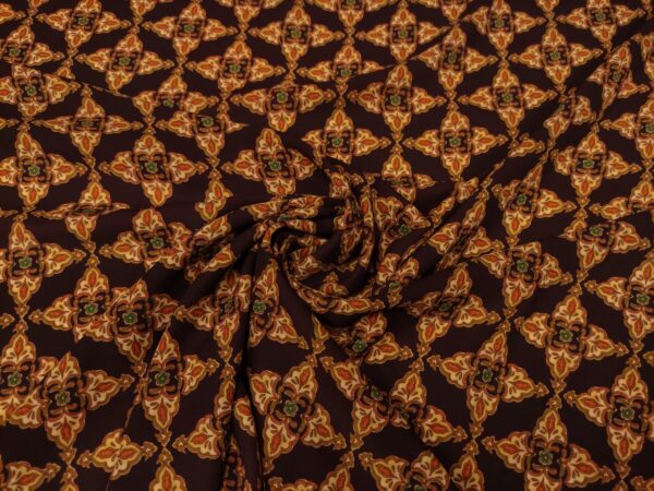 Tessuto Georgette a fantasia motivo etnico bordeaux - arancione