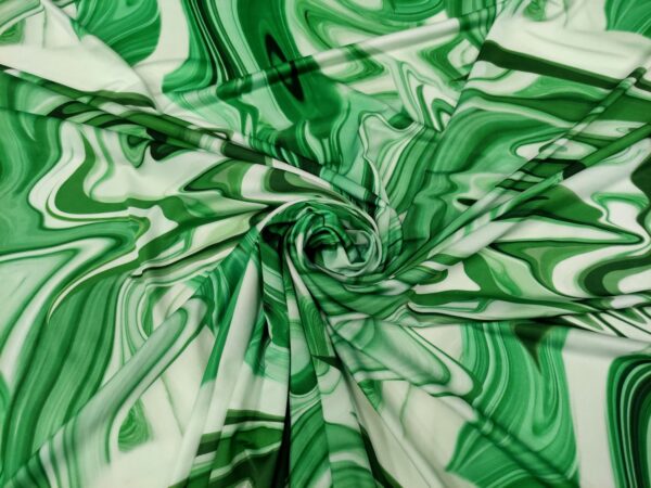 Tessuto jersey a fantasia motivo astratto verde - bianco