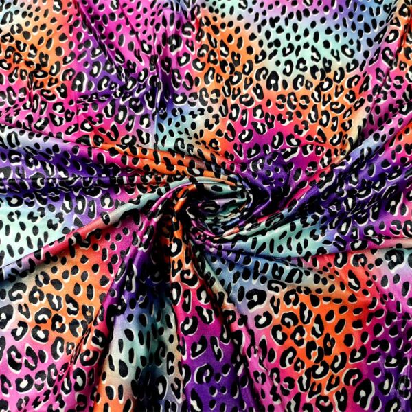 Tessuto Lycra a fantasia motivo animalier viola - arancione