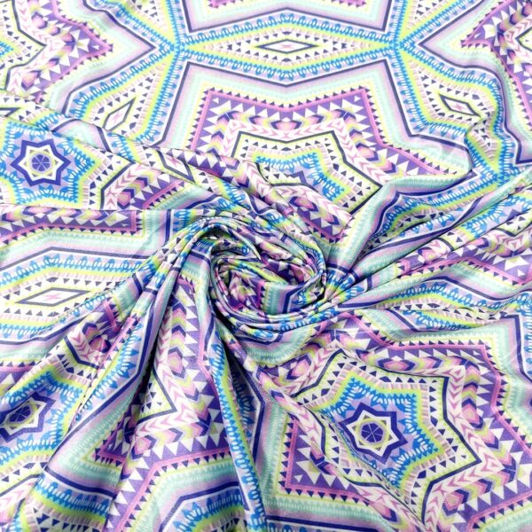 Tessuto Lycra a fantasia motivo etnico celeste - lilla - turchese