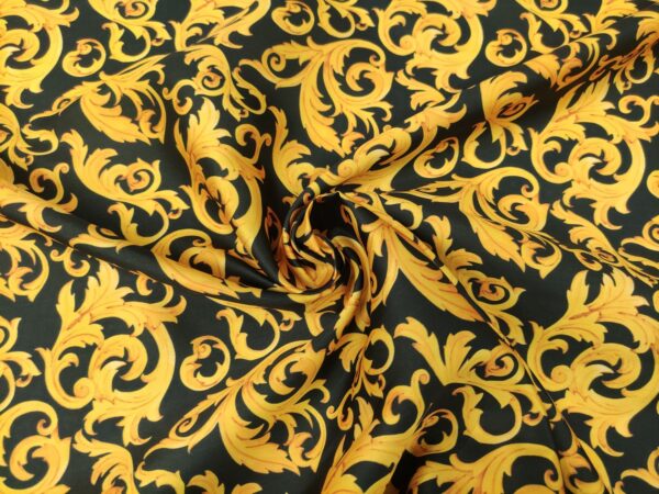 Tessuto Mikado a fantasia motivo floreale barocco nero - giallo oro