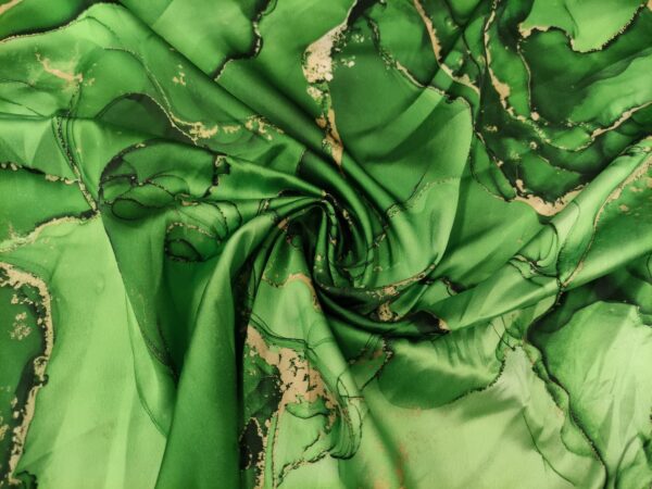 Tessuto Satin a fantasia motivo astratto verde prato