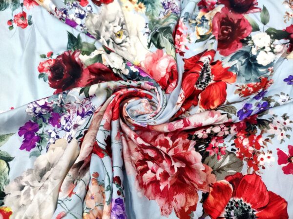 Tessuto Viscosa a fantasia motivo floreale celeste rosso