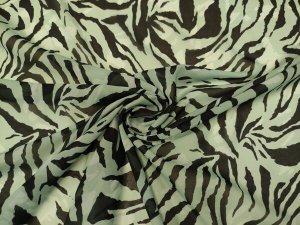 Tessuto Chiffon a fantasia motivo animalier acquamarina - nero