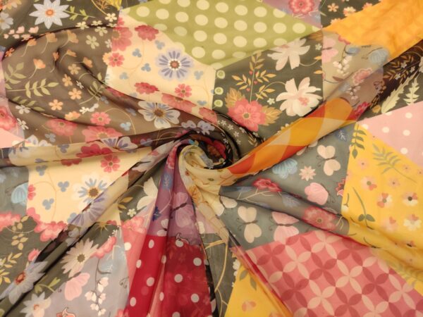 Tessuto Chiffon a fantasia motivo astratto giallo - blu