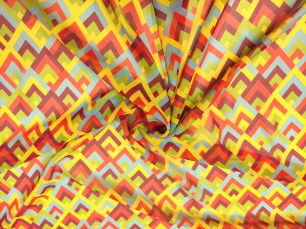 Tessuto Chiffon a fantasia motivo geometrico giallo - arancione