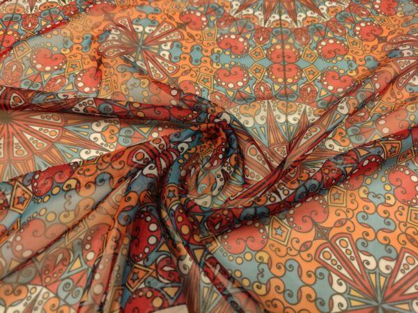 Tessuto Chiffon a fantasia motivo etnico arancione - turchese