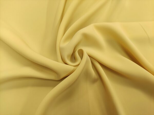 Tessuto Crepe morbido in tinta unita giallino