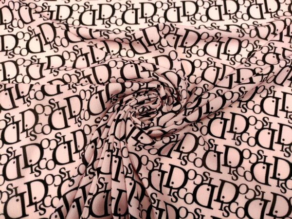 Tessuto Crepe a fantasia motivo astratto nero - rosa