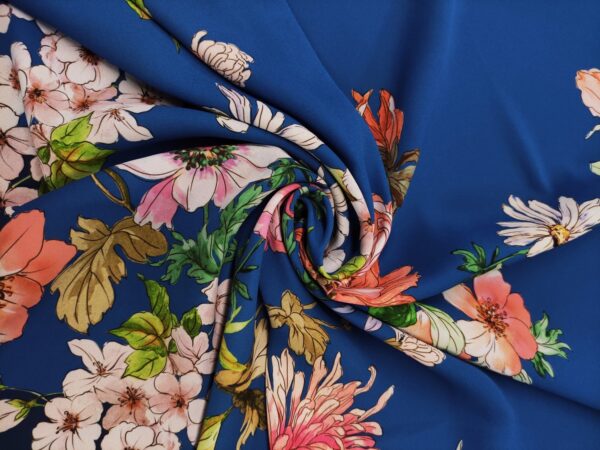 Tessuto Crepe a fantasia motivo blu - rosa