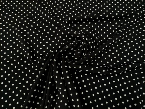 Tessuto Crepe a fantasia motivo pois bianco - nero