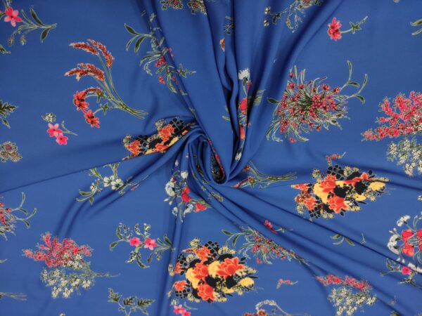 Tessuto Crepe a fantasia motivo floreale blu elettrico - fucsia