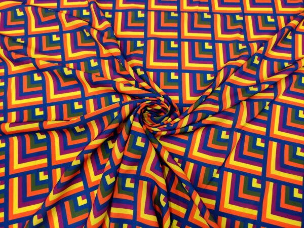 Tessuto Crepe a fantasia motivo geometrico arancione - giallo - verde