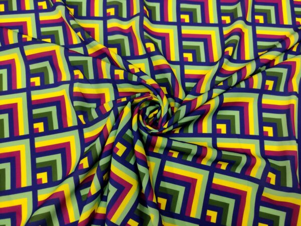 Tessuto Crepe a fantasia motivo geometrico blu - giallo - verde