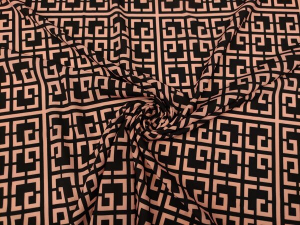 Tessuto Crepe a fantasia motivo geometrico nero - rosa