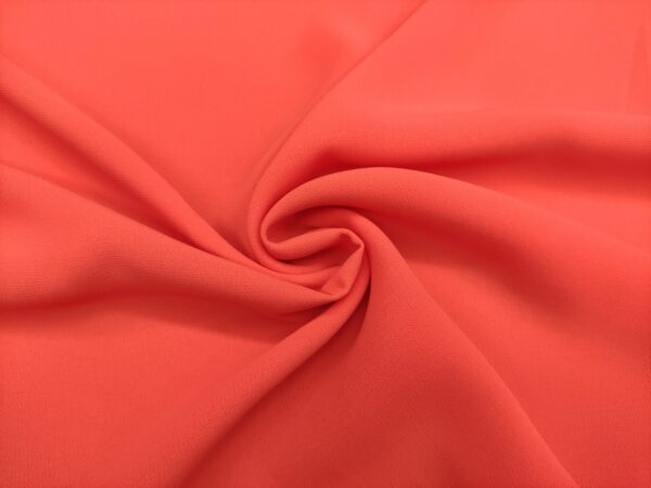 Tessuto Crepe morbido in tinta unita corallo