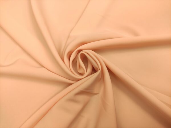 Tessuto Crepe morbido in tinta unita pesca