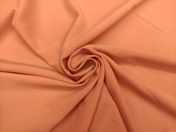 Tessuto Crepe morbido in tinta unita rosa salmone