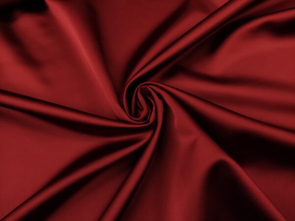 Tessuto Duchesse elasticizzato in tinta unita bordeaux