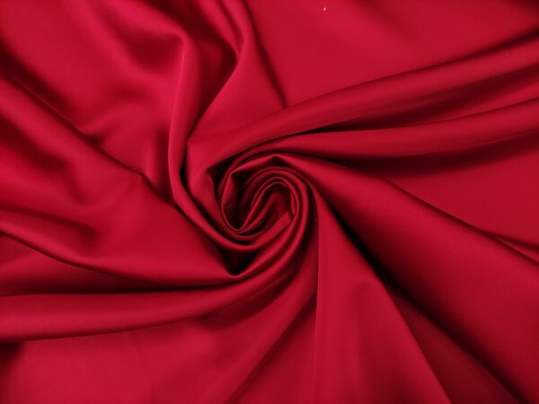 Tessuto Duchesse elasticizzato in tinta unita rosso scuro