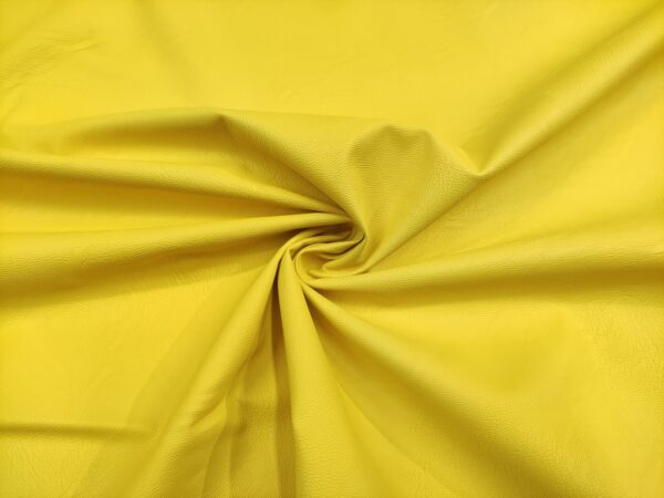 Tessuto Ecopelle per abbigliamento tinta unita giallo