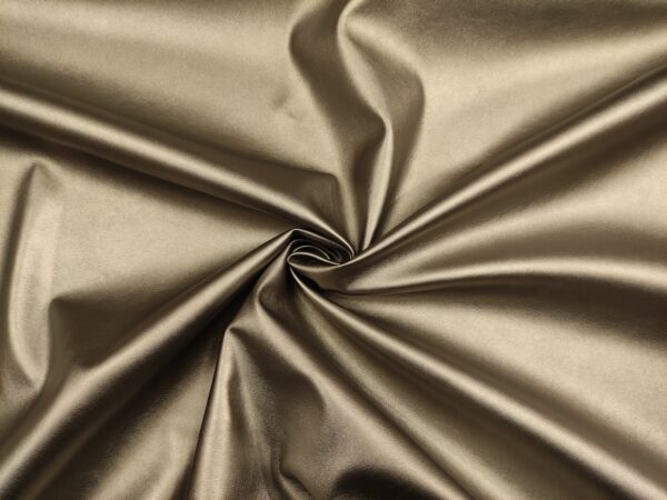 Tessuto Ecopelle per abbigliamento tinta unita lucido tortora