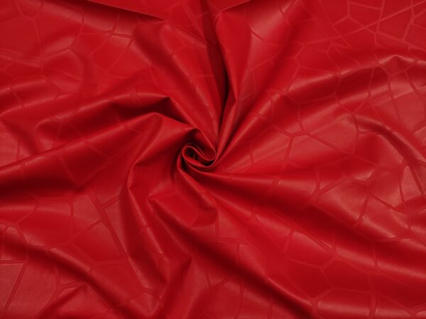 Tessuto Ecopelle per abbigliamento tinta unita rosso motivo astratto