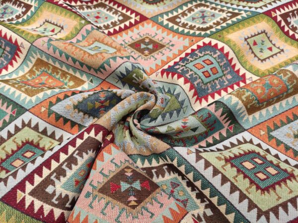 Tessuto Gobelin a fantasia motivo etnico beige - arancione - verde - rosso