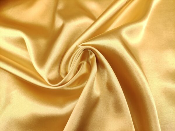 Tessuto Satin leggero elasticizzato tinta unita oro
