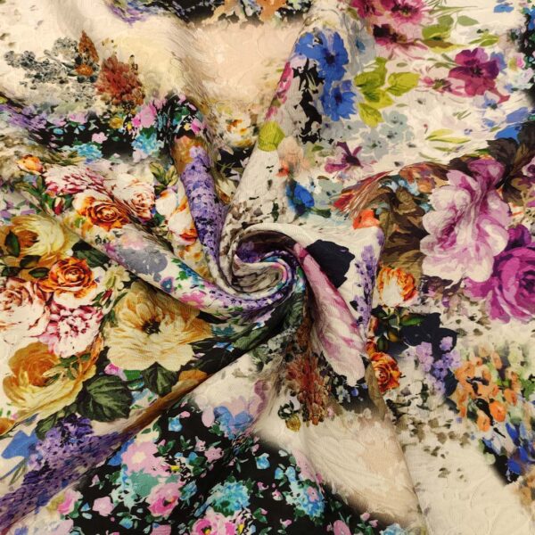 Tessuto Broccato in cotone a fantasia motivo floreale nero - fucsia - azzurro - lilla - bianco - verde