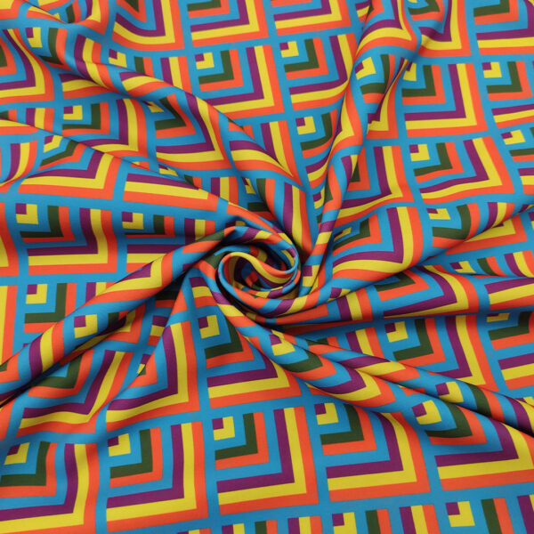 Tessuto Cady elasticizzato a fantasia motivo geometrico turchese - arancione