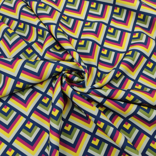 Tessuto Cady elasticizzato a fantasia motivo geometrico blu - verde - giallo