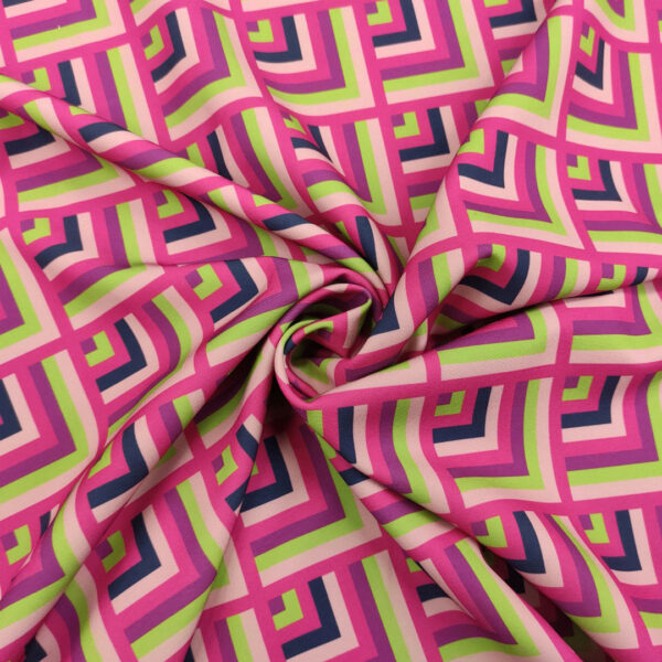 Tessuto Cady elasticizzato a fantasia motivo geometrico verde - fucsia - viola