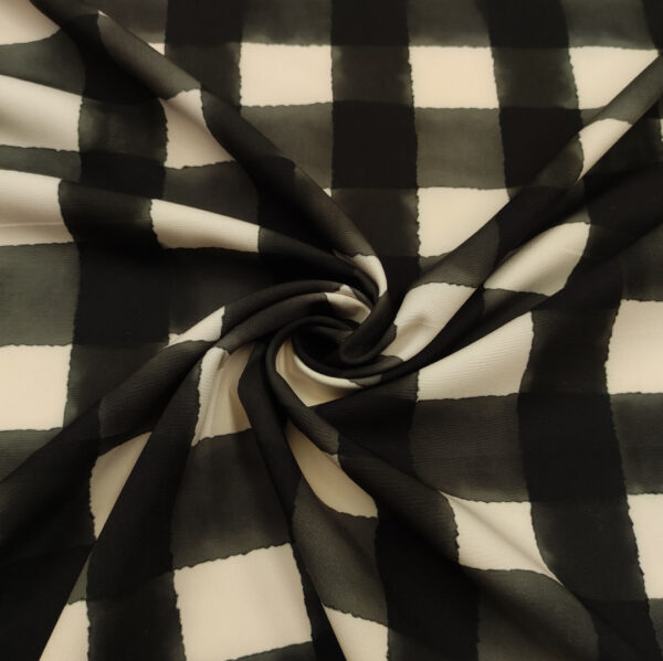 Tessuto Cady elasticizzato a fantasia motivo quadri panna - nero