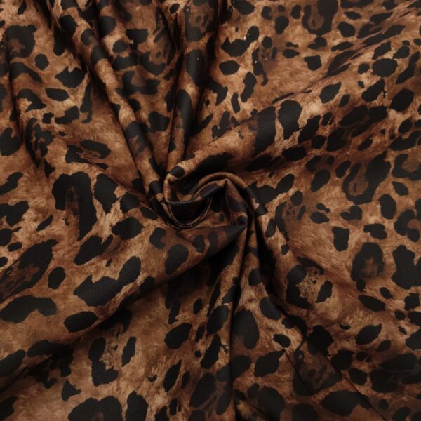 Tessuto Cady elasticizzato a fantasia motivo animalier marrone - nero