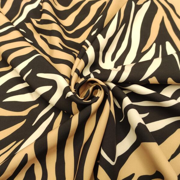Tessuto Cady elasticizzato a fantasia motivo animalier nero - tabacco - bianco