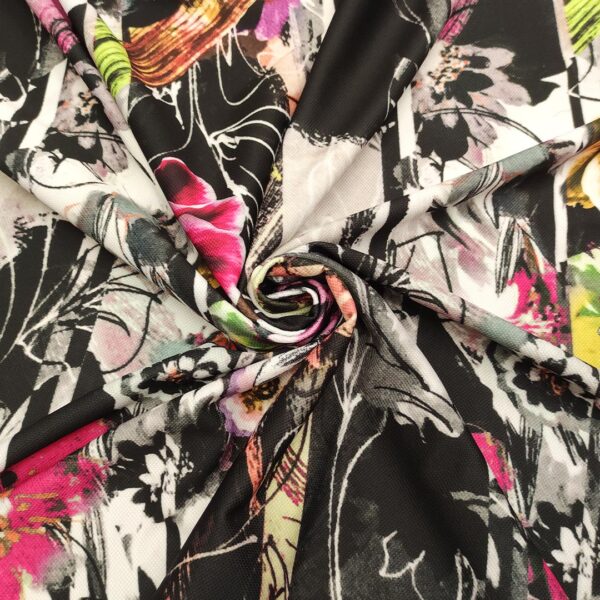 Tessuto Cady elasticizzato a fantasia motivo floreale bianco - nero - fucsia - verde