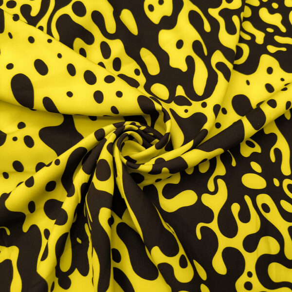 Tessuto Cady elasticizzato a fantasia motivo astratto giallo - nero