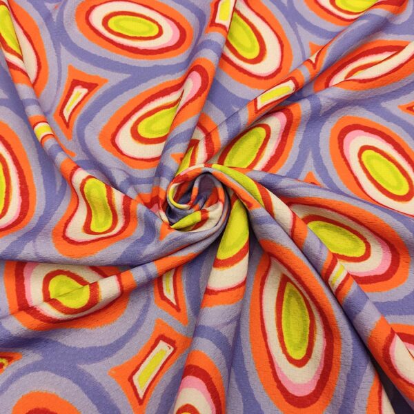 Tessuto Cady elasticizzato a fantasia motivo astratto lilla - giallo - arancione - rosso