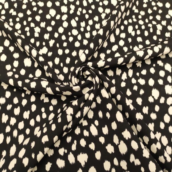 Tessuto Cady elasticizzato a fantasia motivo astratto nero - bianco