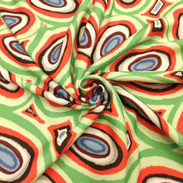 Tessuto Cady elasticizzato a fantasia motivo astratto verde - menta - arancione - nero