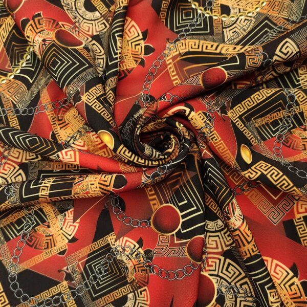 Tessuto Cady elasticizzato a fantasia motivo floreale barocco bordeaux - nero - oro